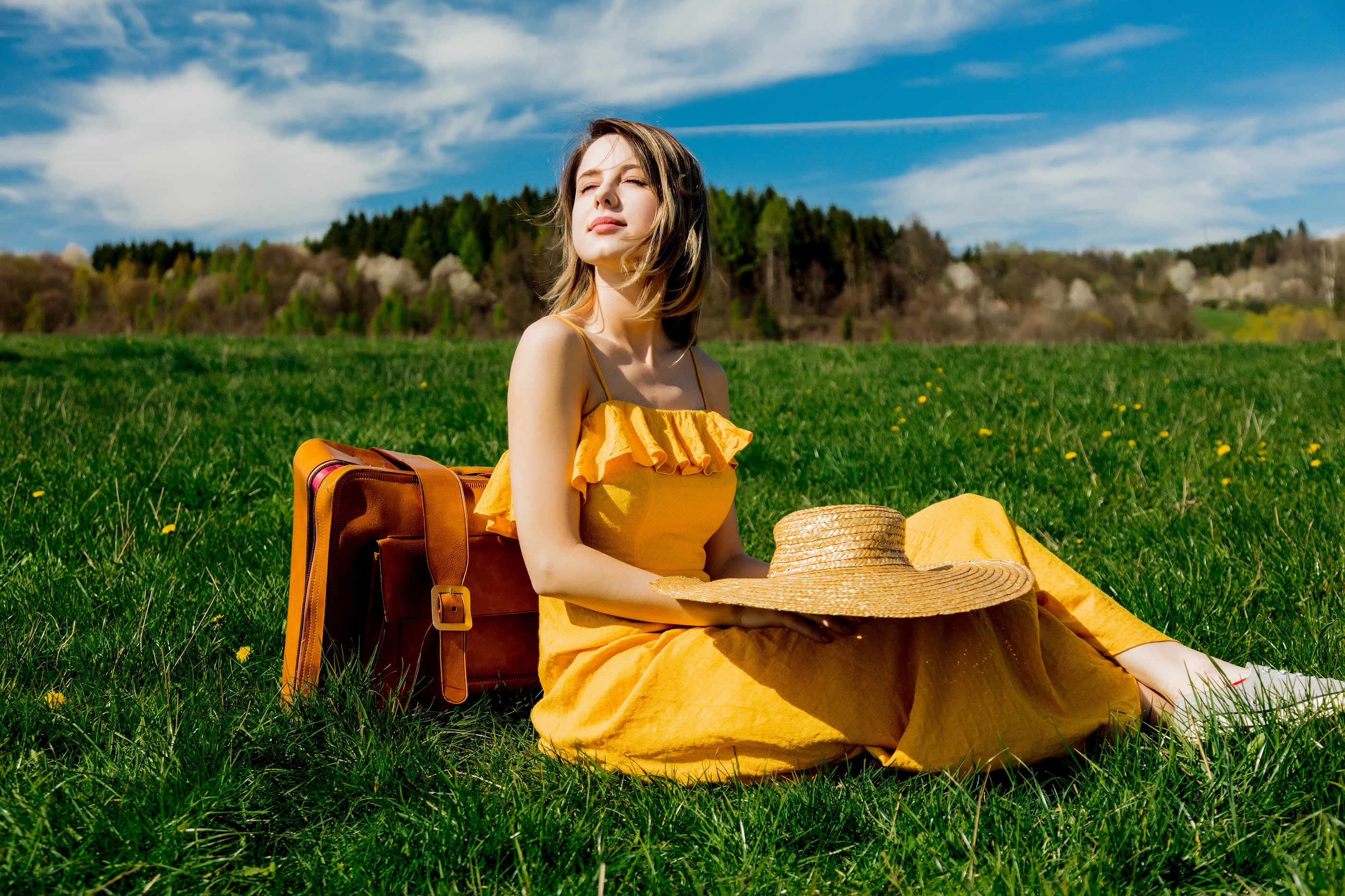 girl-in-yellow-dress-and-suitcase-sitting-on-mount-2022-01-12-00-26-33-utc.jpg