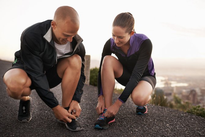 readying-for-the-run-shot-of-a-sporty-couple-stre-2022-10-07-20-29-43-utc.jpg